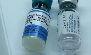 Close-up image of two MMR vaccine vials for measles, mumps, and rubella.