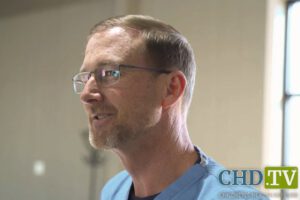 Dr. Ben Edwards with visible measles rash while treating children at makeshift clinic in Seminole, Texas, in video posted by Children’s Health Defense.