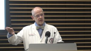 Dr. Ron Cook speaks at a Lubbock press conference emphasizing the importance of the measles vaccine and herd immunity.