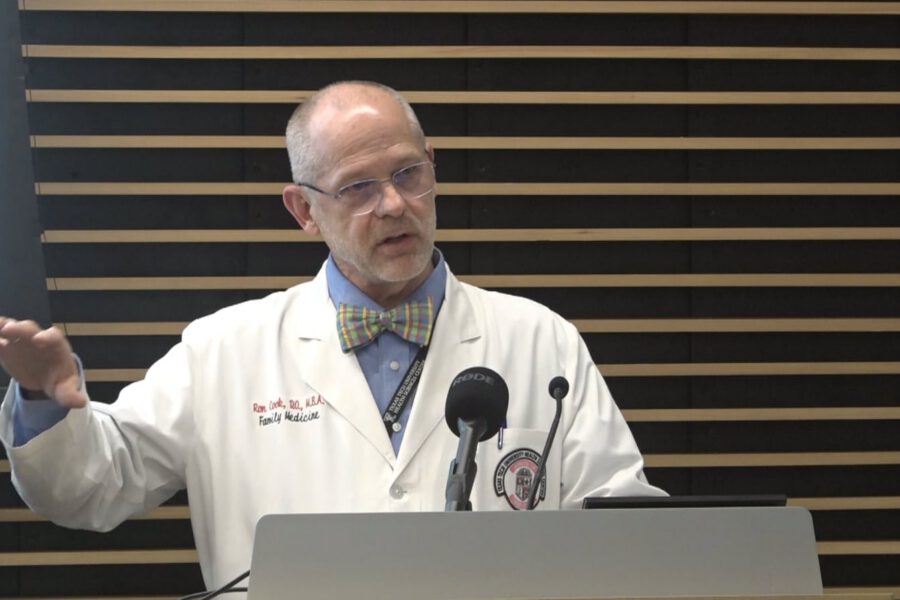 Dr. Ron Cook speaks at a Lubbock press conference emphasizing the importance of the measles vaccine and herd immunity.