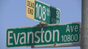 Street signs marking the intersection of 108th Street and Evanston Avenue in Lubbock, Texas, where a Lubbock Police Department K-9 attacked two individuals in April 2025, leading to injuries, a suspension, and the reassignment of the involved officer.