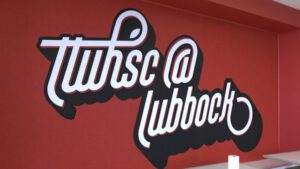 TTUHSC Lubbock campus signage highlighting the nursing shortage and recruitment efforts in Texas.