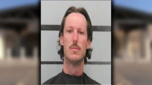 Mugshot of Corey Dellinger, 36, arrested in Lubbock for stalking and making violent threats toward family and strangers.