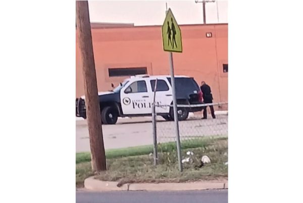 Lubbock police officer seen urinating in public near patrol vehicle behind a local church.