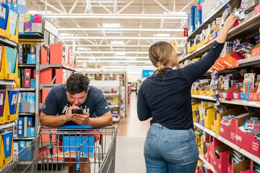 Shoppers in a store aisle picking out school supplies as rising tariffs drive up prices on everyday items.
