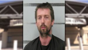 Booking photo of Dustin Arnold, 36, arrested in Lubbock on charges of indecency with a child after alleged abuse from 2020 to 2023.