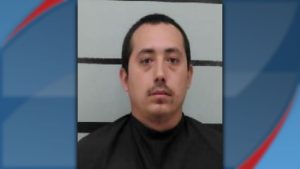 Mugshot of John Jimenez Jr., 26, arrested in Lubbock for robbery, violating a restraining order, and multiple related charges.