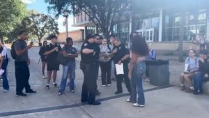 Texas Tech police officers speak with students outside the Student Union following Charlie Kirk memorial incident.