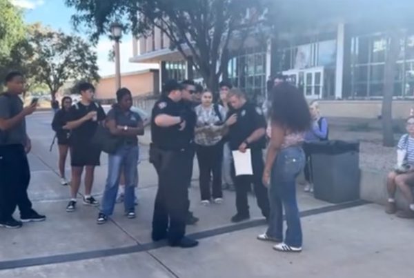 Texas Tech police officers speak with students outside the Student Union following Charlie Kirk memorial incident.