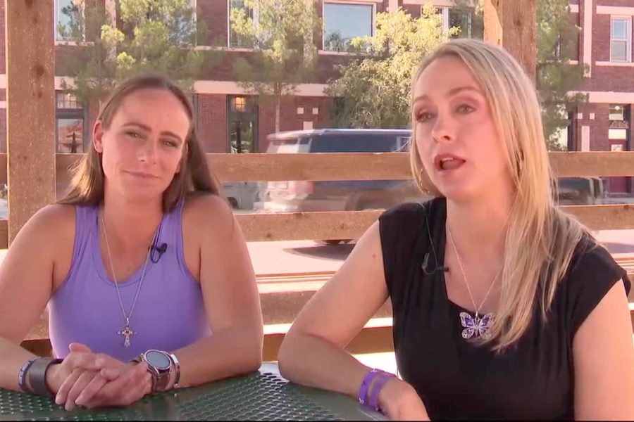 Two South Plains women sit at an outdoor table during a TV interview, discussing how the justice system failed to protect them from domestic violence.