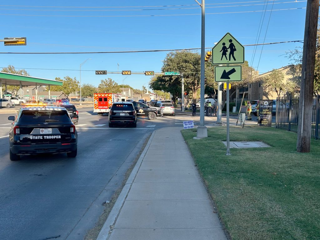 Texas DPS vehicles, ambulance, and officers at the scene of a two-car accident near the intersection of 50th Street and Chicago Avenue in Lubbock, Texas.