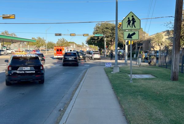 Texas DPS vehicles, ambulance, and officers at the scene of a two-car accident near the intersection of 50th Street and Chicago Avenue in Lubbock, Texas.