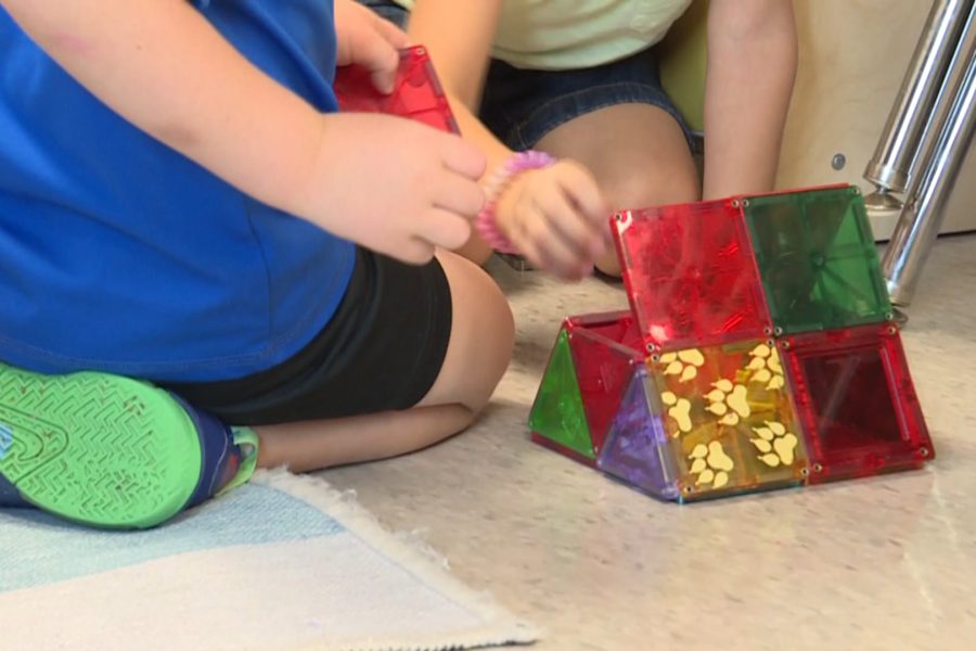 Children in a Lubbock daycare classroom playing with colorful magnetic building blocks, highlighting child care shortages across the South Plains.