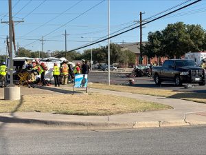 Emergency crews respond to a major crash at 54th Street and Slide Road in Lubbock after a stolen truck fleeing police flipped and struck a telephone pole.