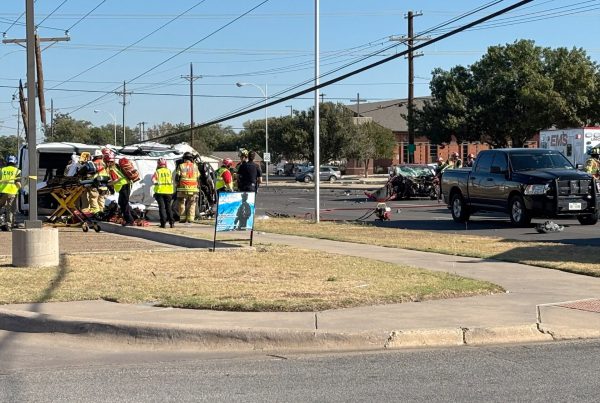 Emergency crews respond to a major crash at 54th Street and Slide Road in Lubbock after a stolen truck fleeing police flipped and struck a telephone pole.
