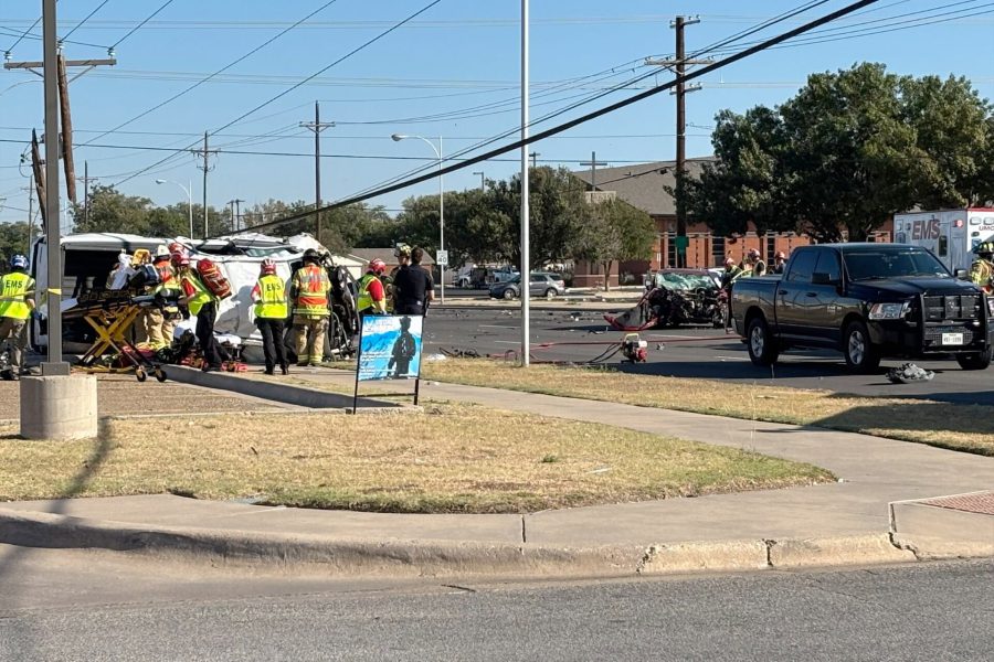 Emergency crews respond to a major crash at 54th Street and Slide Road in Lubbock after a stolen truck fleeing police flipped and struck a telephone pole.