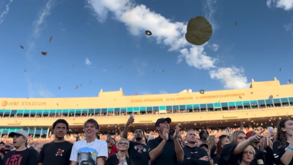 Texas Tech fans at Jones AT&T Stadium toss tortillas into the air during a football game, continuing the university’s iconic and controversial game-day tradition.