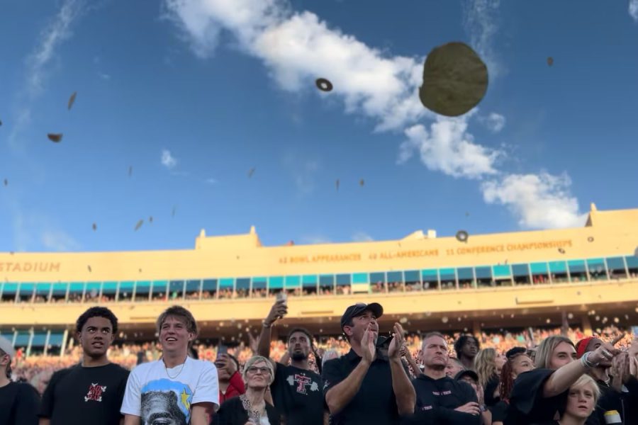 Texas Tech fans at Jones AT&T Stadium toss tortillas into the air during a football game, continuing the university’s iconic and controversial game-day tradition.