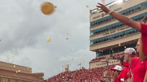 Tortillas flying through the air at Jones AT&T Stadium as Texas Tech fans celebrate kickoff during a home football game.