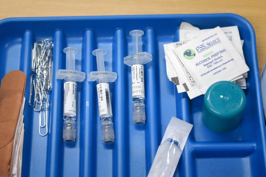 Syringes, alcohol prep pads, and medical supplies arranged in a tray during a vaccination drive at the City of Lubbock Health Department.