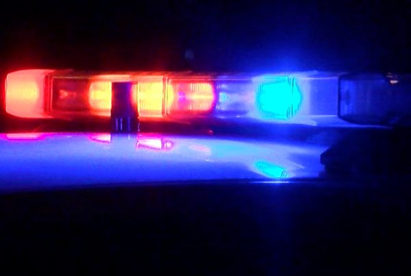 Flashing red and blue lights from a Lubbock Police Department vehicle at night.