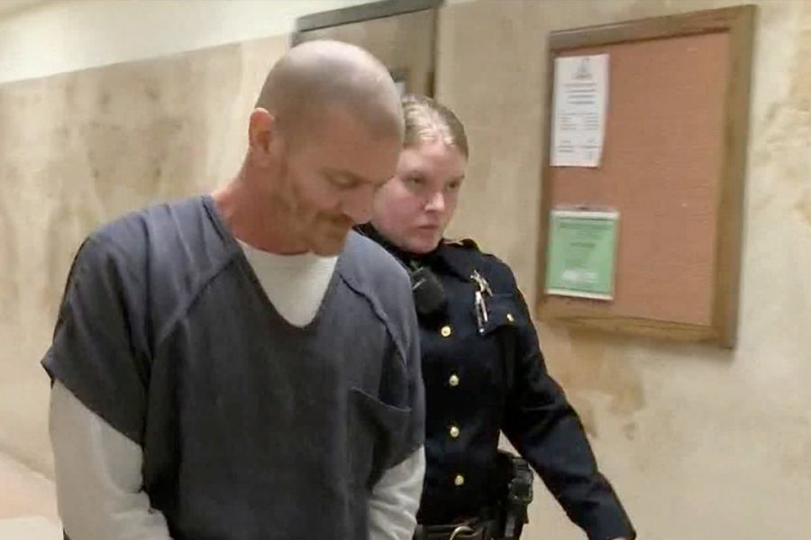 Lubbock County inmate escorted by deputy after sentencing for child sexual assault.