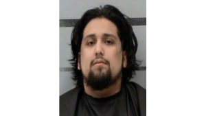 Mugshot of a man with medium-length dark hair and a goatee, identified by authorities as Xavier Garcia in connection with two Lubbock murder cases.