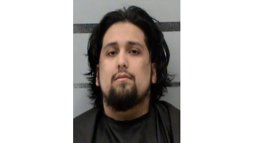 Mugshot of a man with medium-length dark hair and a goatee, identified by authorities as Xavier Garcia in connection with two Lubbock murder cases.