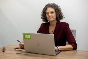 Business owner at a laptop looking concerned after Texas removes most companies from the HUB certification program.