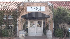 Exterior of Cafe J on 19th Street in Lubbock, a longtime restaurant and bar across from Texas Tech University before its closure and redevelopment.