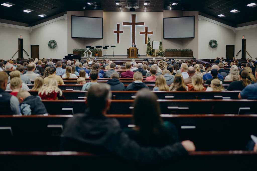 Mennonite congregation gathered inside a church in Seminole, Texas, during the 2025 measles outbreak that drew national attention to low vaccination rates in West Texas.