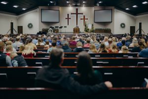 Mennonite congregation gathered inside a church in Seminole, Texas, during the 2025 measles outbreak that drew national attention to low vaccination rates in West Texas.