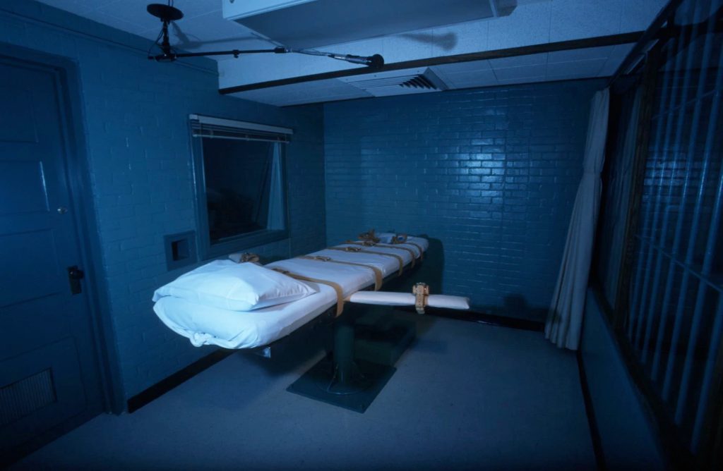 Lethal injection gurney inside a Texas execution chamber, showing the restrained bed used for state executions in Huntsville.