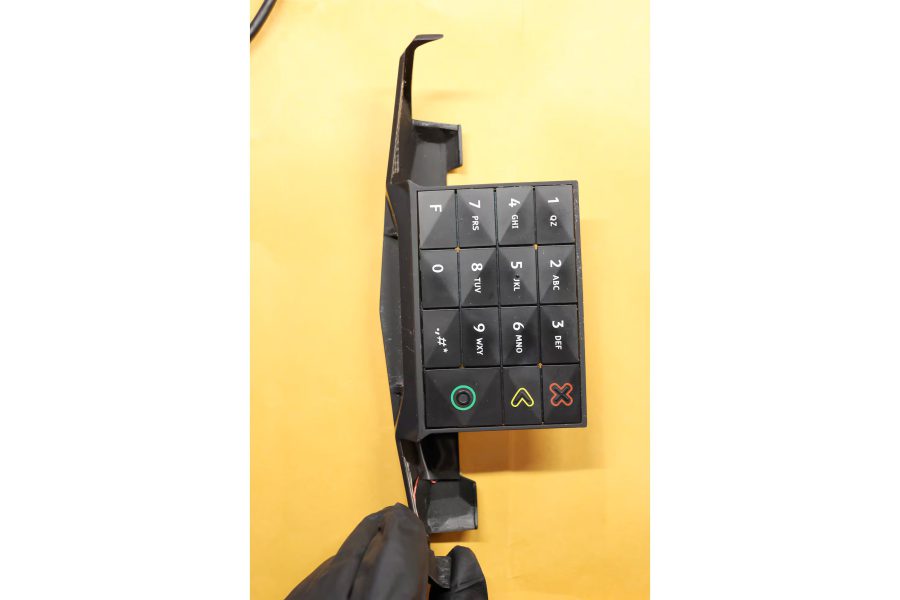 Credit card skimmer keypad device removed from a West Texas retail location, showing the fake keypad overlay used by criminals to capture PIN entries.