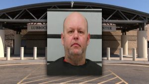 Mugshot of a Lubbock man arrested after allegedly vandalizing a construction site with ‘666’ graffiti and attempting to run over workers, shown in front of the Lubbock County Detention Center.