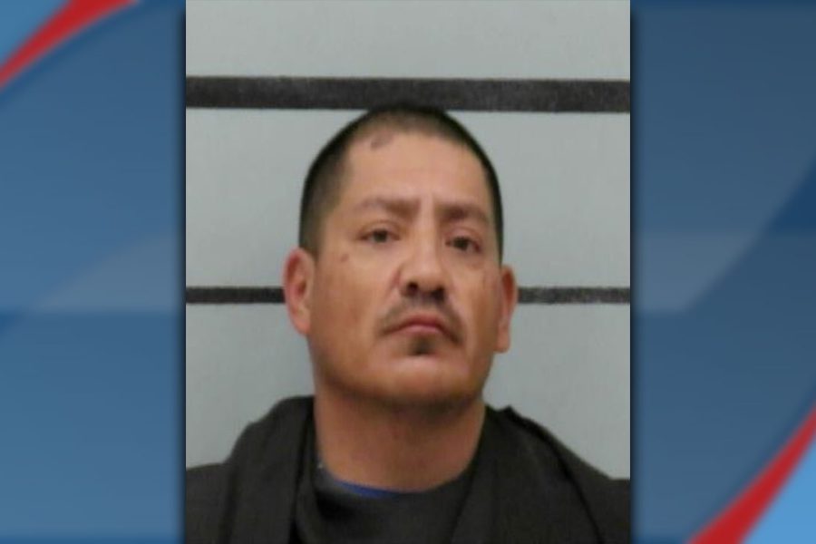 Mugshot of Lorenzo Robles, arrested in Lubbock on assault and drug charges, shown against a height chart background.