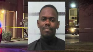 Police crime scene on Avenue Q in Lubbock with a booking-style portrait of Drukerick Dickson in the image during a two-shooting investigation.