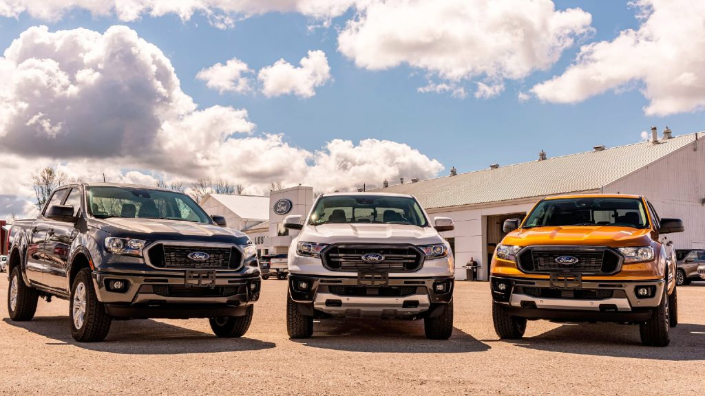 Three Ford F-150 pickup trucks lined up at a Lubbock dealership, illustrating the city’s overwhelming love for full-size trucks.