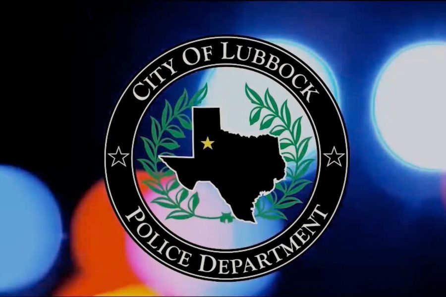 City of Lubbock Police Department seal displayed over blurred red and blue emergency lights.