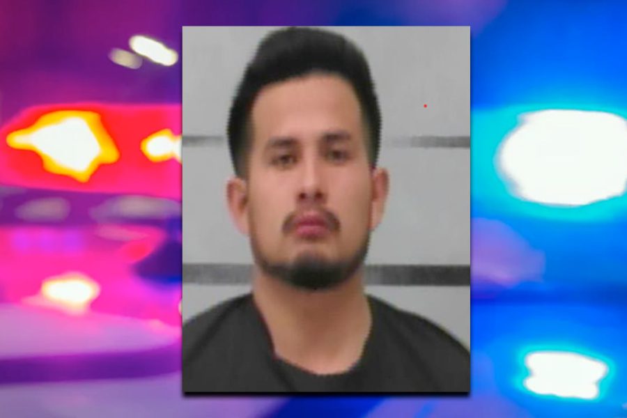 Arrest photo of Alex Matheu Martinez with blurred police lights in the background following a Slaton knife attack that led to an officer-involved shooting.