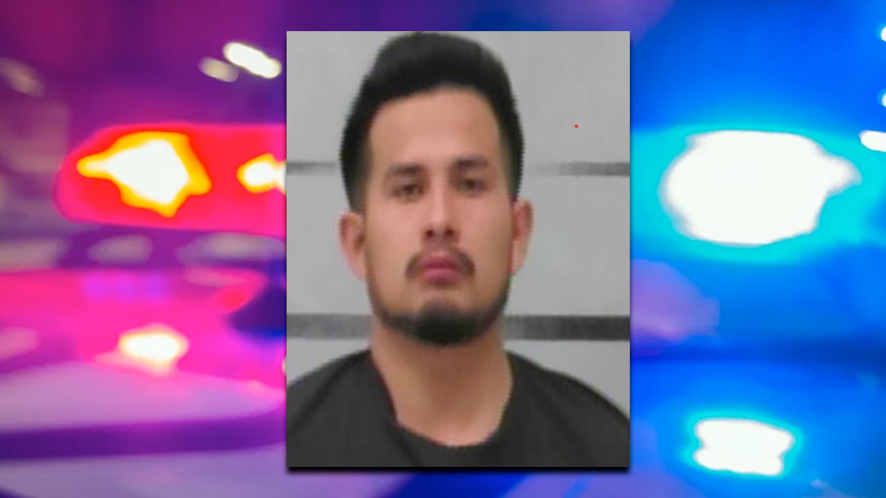 Arrest photo of Alex Matheu Martinez with blurred police lights in the background following a Slaton knife attack that led to an officer-involved shooting.