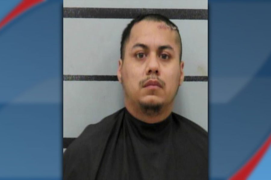 A mugshot of Jeremiah Guerrero, 27, who faces a Deadly Conduct charge in Lubbock. He is shown from the chest up against a gray background with horizontal black lines, with visible staples or stitches on the left side of his forehead.