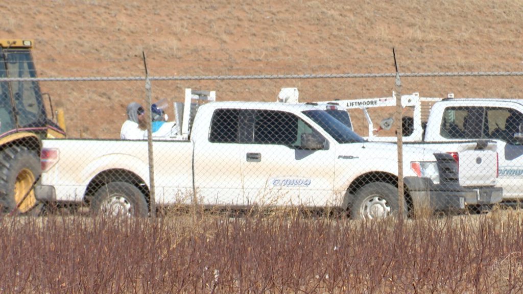 City of Lubbock and CRMWA personnel wearing protective gear and using heavy equipment to remove and bury dead geese at the North Water Treatment Plant.