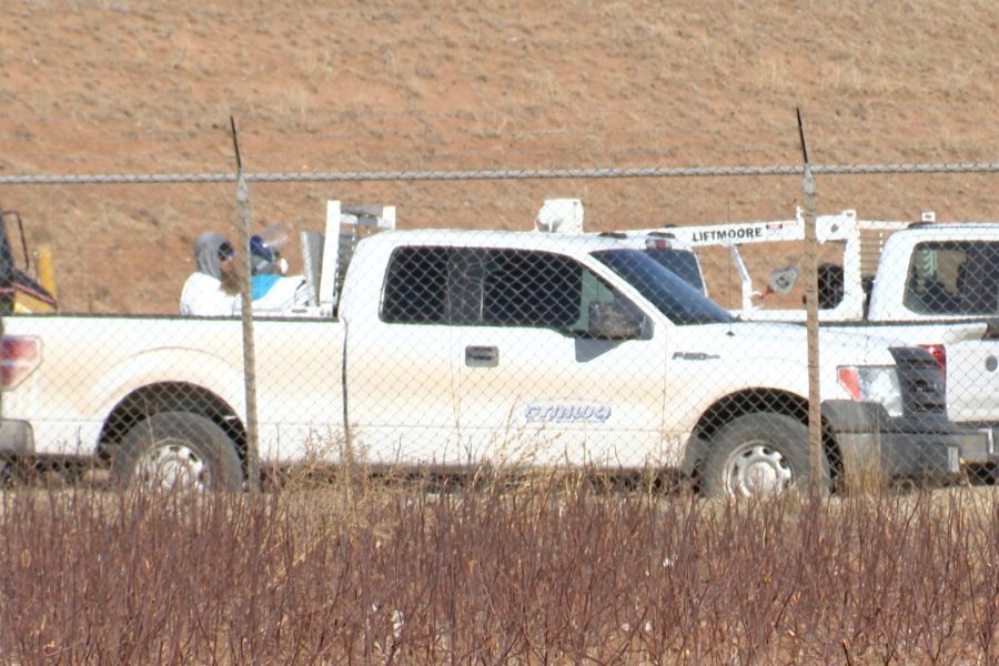 City of Lubbock and CRMWA personnel wearing protective gear and using heavy equipment to remove and bury dead geese at the North Water Treatment Plant.