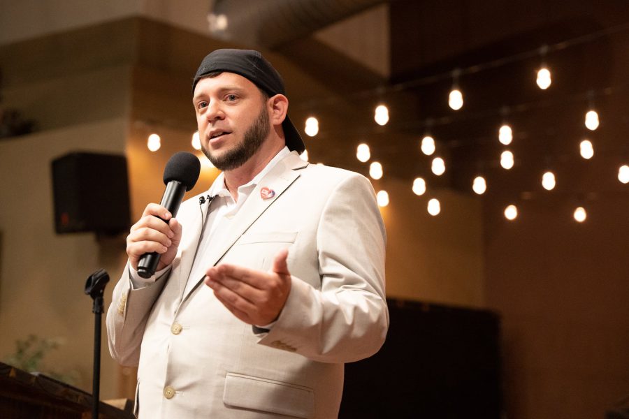Anti-abortion activist Mark Lee Dickson in his signature 'youth pastor' aesthetic—a backward black baseball cap and light suit—preaching the gospel of private-enforcement lawsuits.