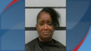 Aleshia Banks mugshot featuring a distressed expression following her arrest for aggravated assault in Lubbock.