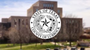 The official seal of Lubbock County, Texas, superimposed over a blurry courthouse—perfectly capturing the hazy, indistinct focus our local leaders bring to actual systemic problems.