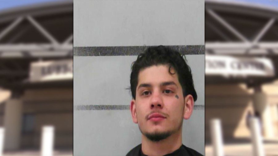 Mugshot of Zeylium Rodriguez, a man with dark hair and a small tattoo under his left eye, following an arrest for aggravated assault at a Lubbock Sam's Club.