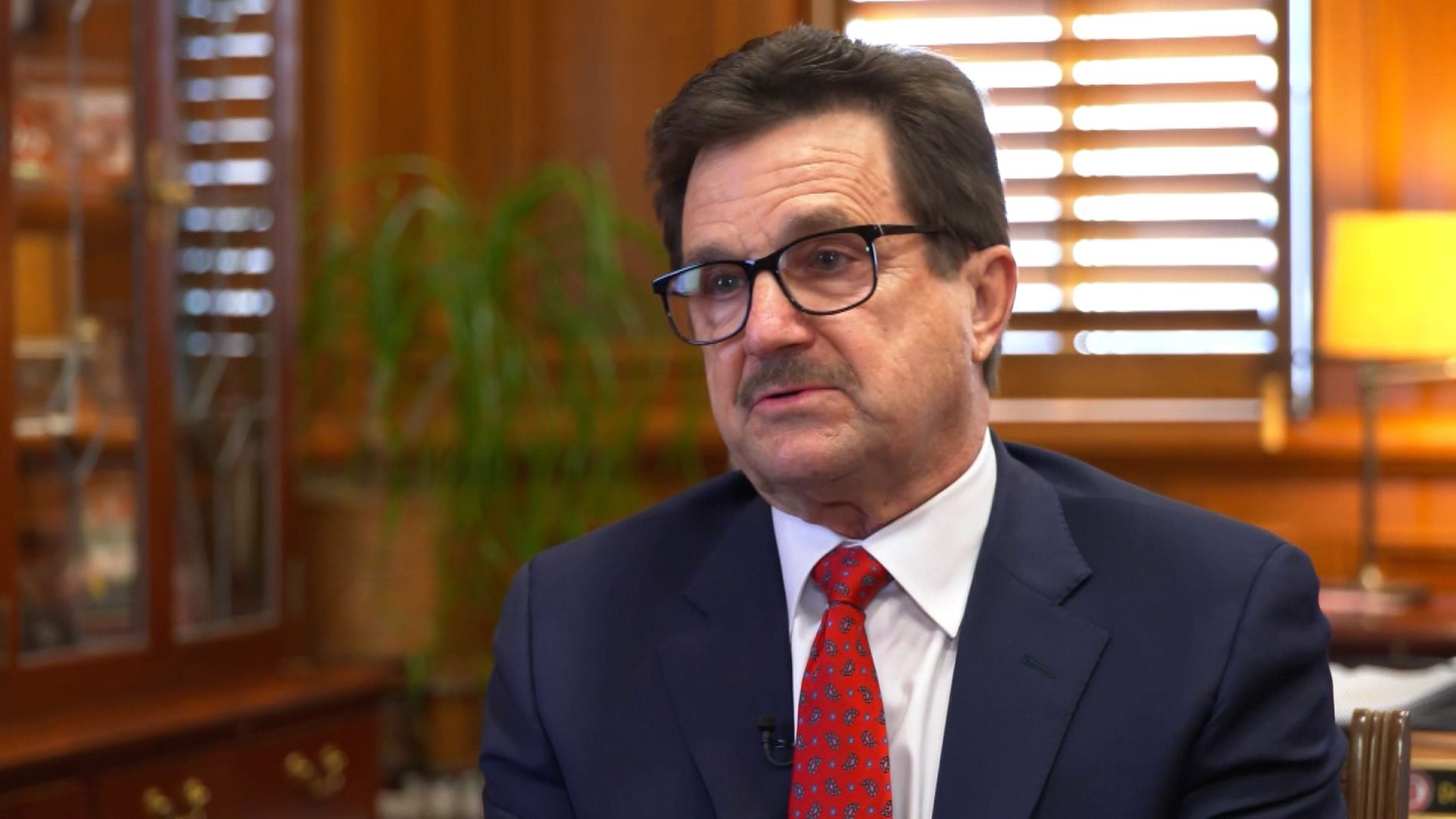 Texas Tech President Lawrence Schovanec sporting his finest "please don't take our football money" expression while wearing a tie that probably cost more than a graduate student’s monthly stipend.