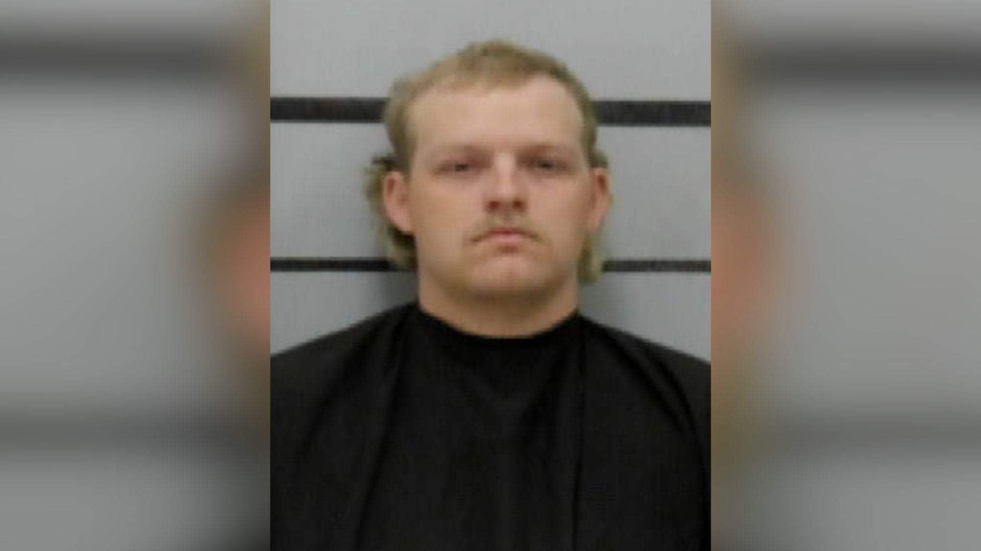 Mugshot of Zachary Peterson, featuring a blonde mullet and a mustache, looking remarkably unbothered for someone who just fumbled the most generous probation deal in Lubbock history.